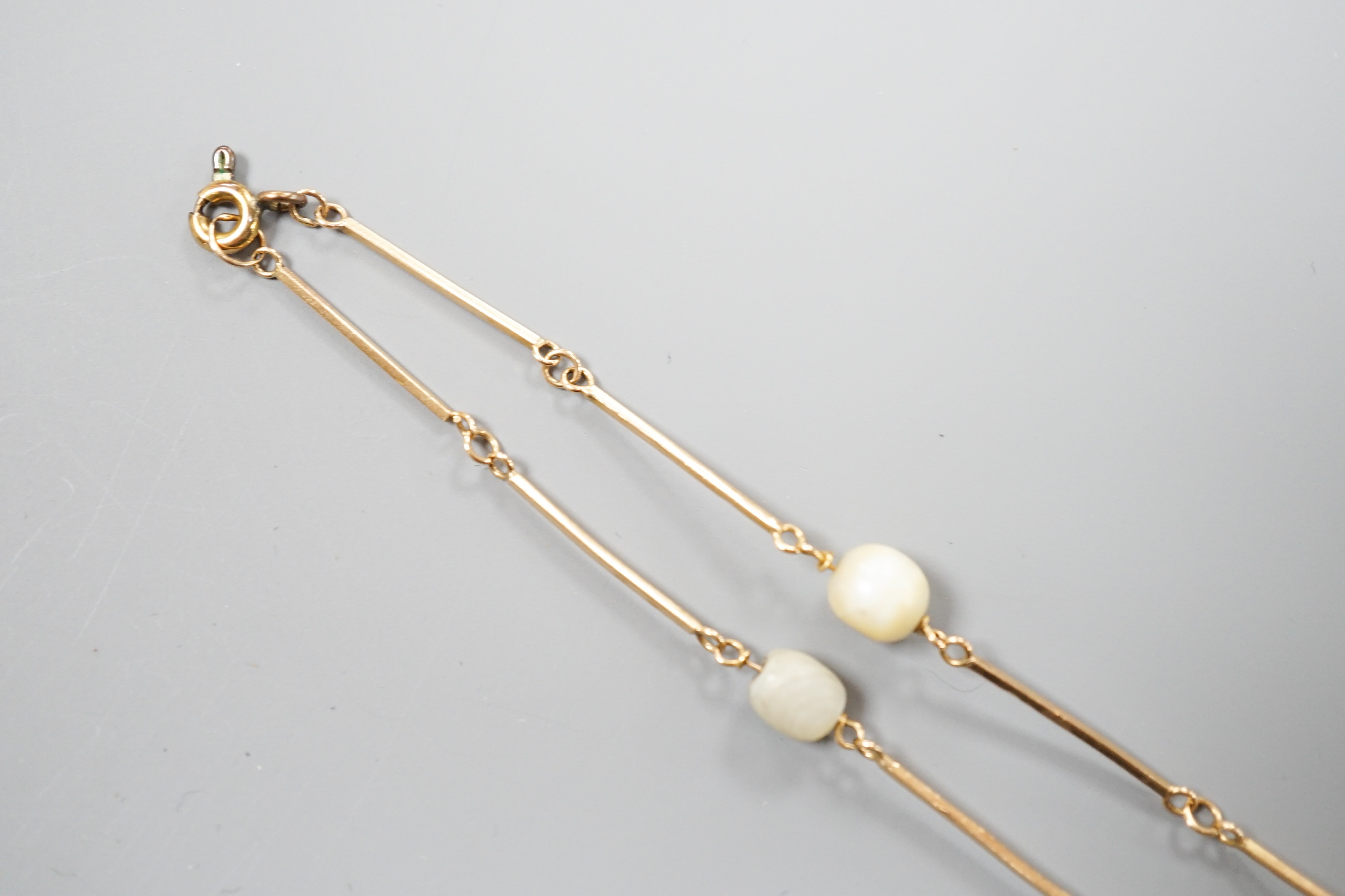 A yellow metal and cultured pearl set necklet, 70cm, gross weight 11.5 grams.